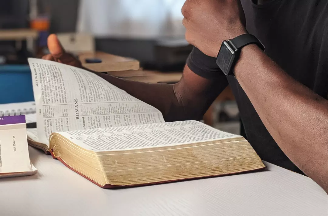 A young man reading the Bible