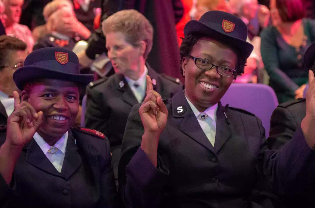 Salvationists giving The Salvation Army salute