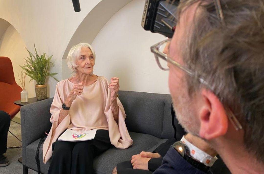 A photo of Dame Sheila Hancock being interviewed in her dressing room