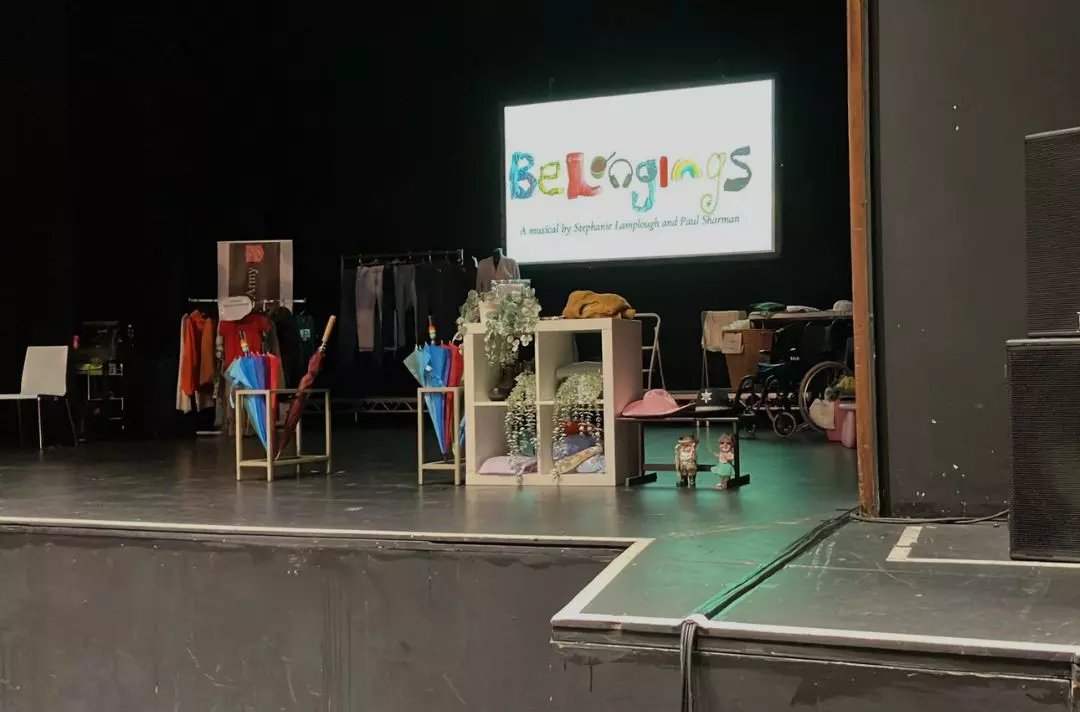 A photo of the stage of Belongings before the performance starts - the scene is a charity shop