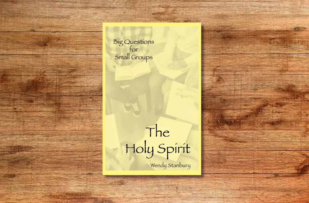 The front cover of the book Big Questions for Small Groups: The Holy Spirit. The cover shows a small group reading the Bible together. There is a yellow filter.