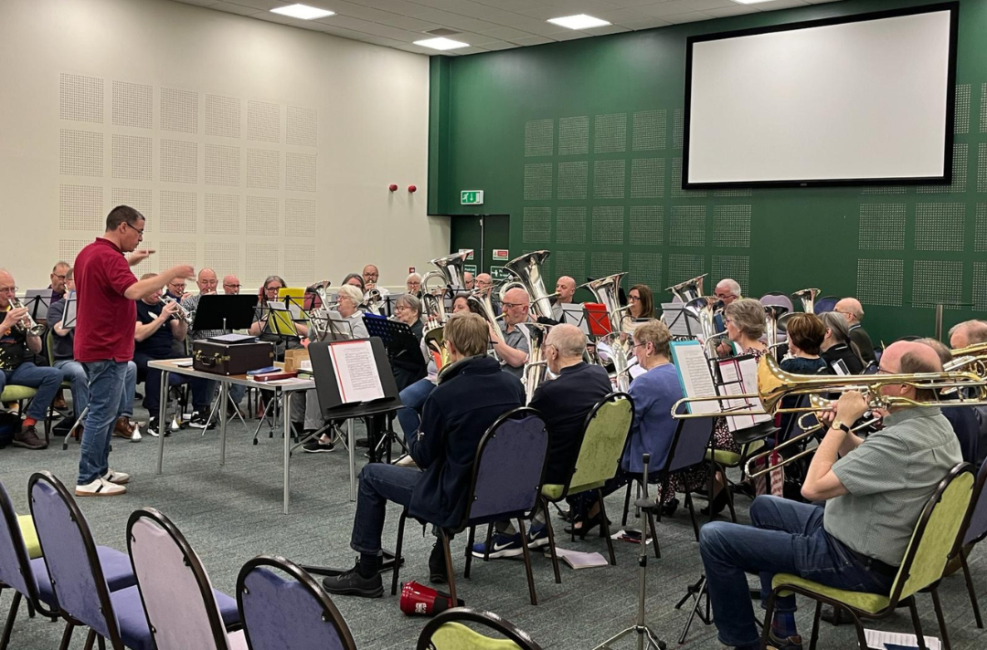 A photo shows an Easter Music Course 2024 brass rehearsal.