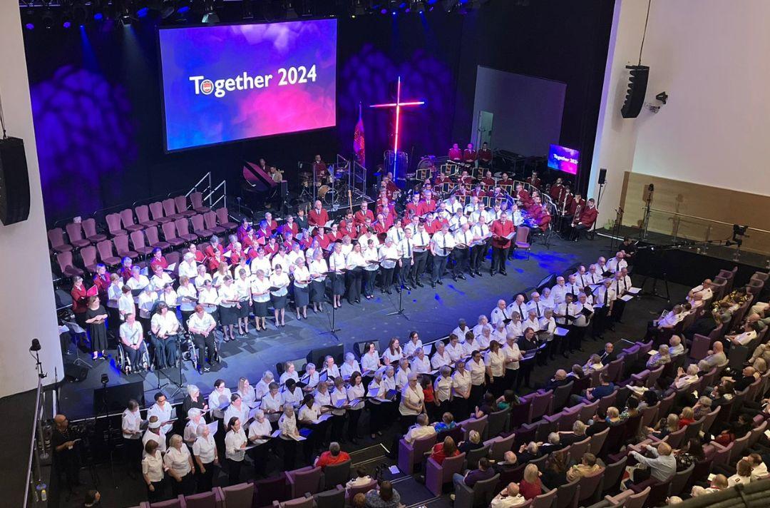 The Welsh Chorus of 100 voices singing on stage at Together 2024