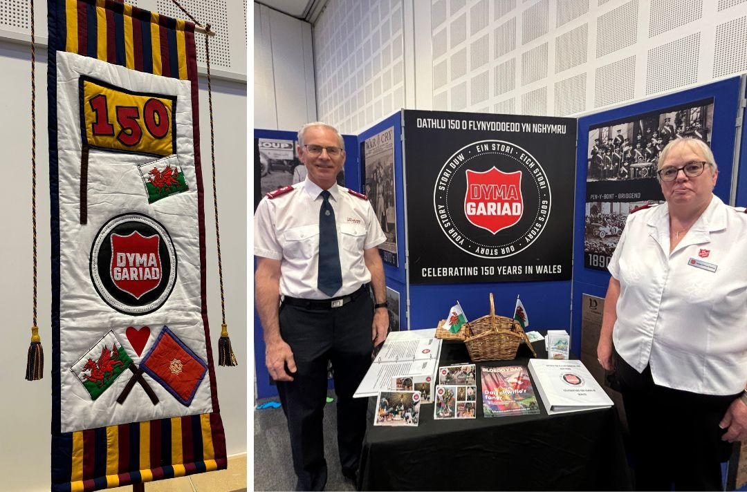 A collage of two photos: The first is of a banner made for the 150th anniversary of The Salvation Army in Wales, featuring The Salvation Army flag and the Welsh flag, the second is of Jonathan Roberts and Kathryn Stowers in front of the anniversary history exhibition
