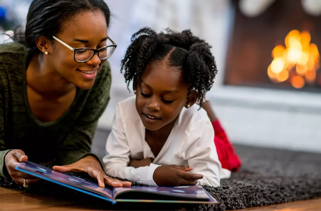 A photo shows a parent and child reading a story together.