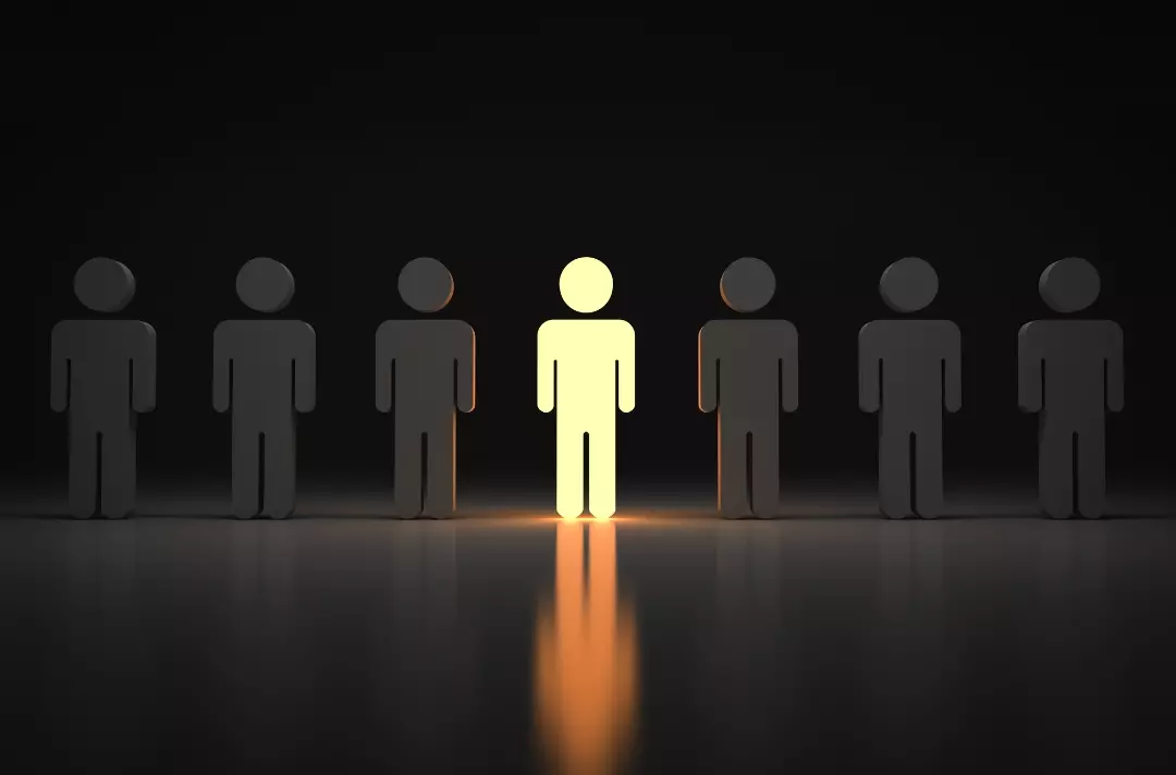 A graphic shows a series of figures standing in darkness. The one in the centre shines with light.