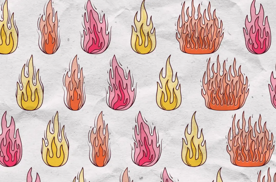 a close-up of crumpled wrapping paper with a repeated illustrated flame motif